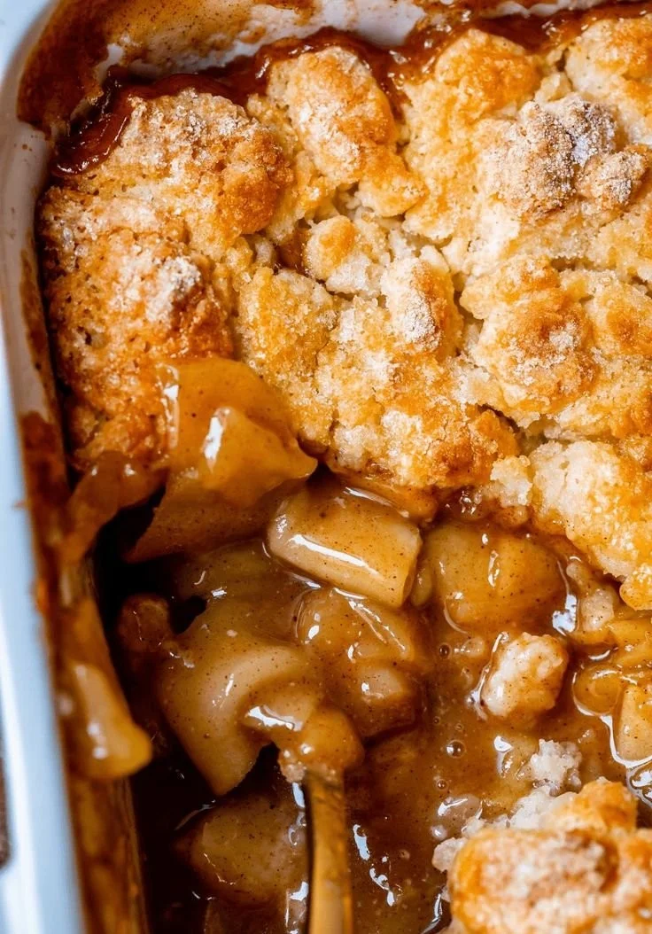 Delicious homemade apple cobbler with golden crust and baked apples