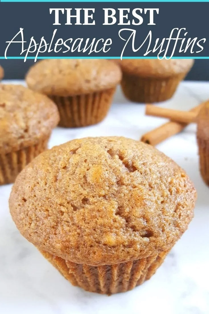 Delicious homemade applesauce muffins displayed on a rustic wooden table.