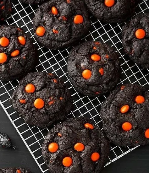 Delicious dark chocolate Halloween cookies decorated with spooky themes