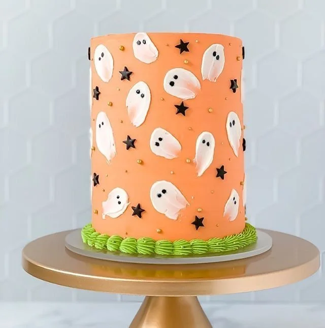 Spooky Ghostly Cake decorated with edible ghosts for Halloween.