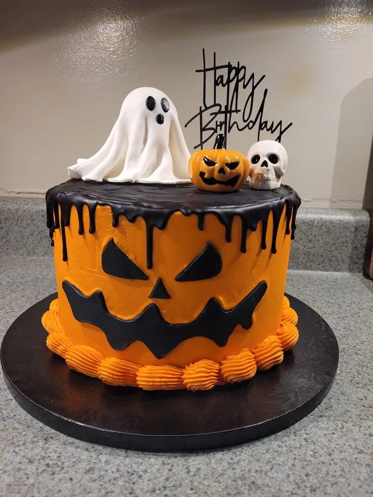 Festive Halloween birthday cake decorated with spooky designs and vibrant colors.