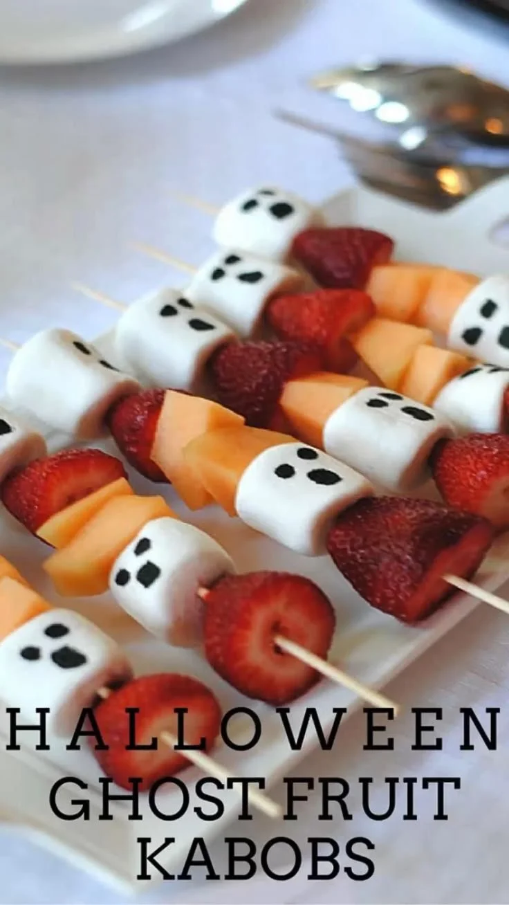 A variety of Halloween party food including spooky appetizers and finger foods.