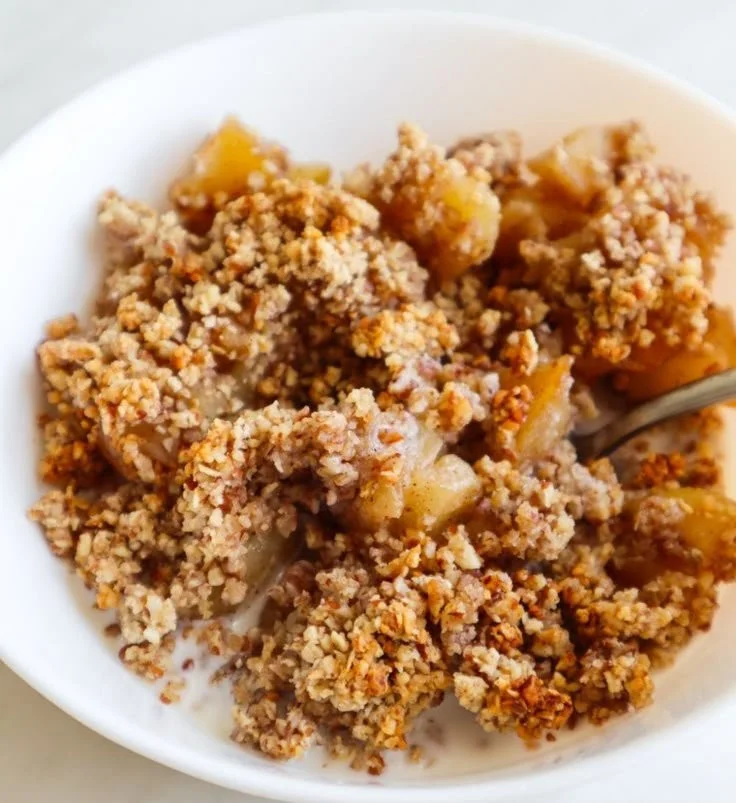 Healthy breakfast apple crumble with fresh apples and a crunchy topping