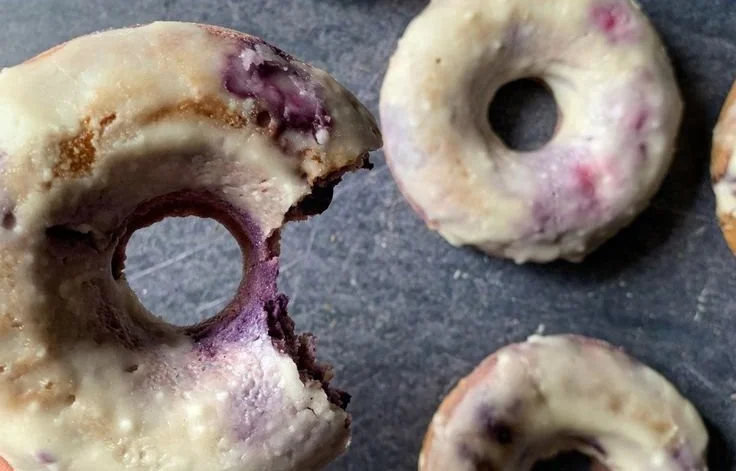 High protein blueberry cake donuts topped with fresh blueberries