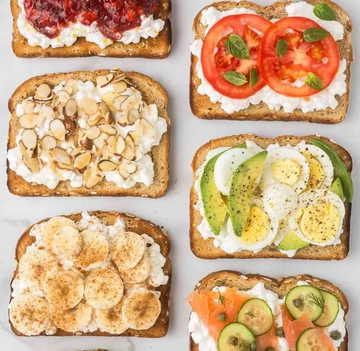 High protein cottage cheese toast topped with fruits and herbs
