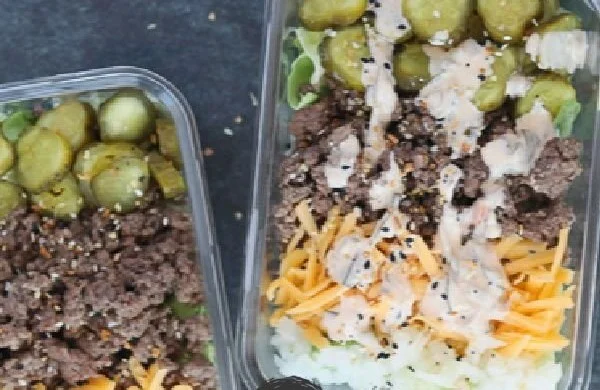 Keto Big Mac Salad with lettuce, beef, cheese, and dressing.