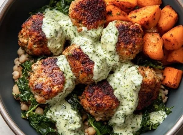 Mediterranean chicken meatball bowl with fresh veggies and sauce