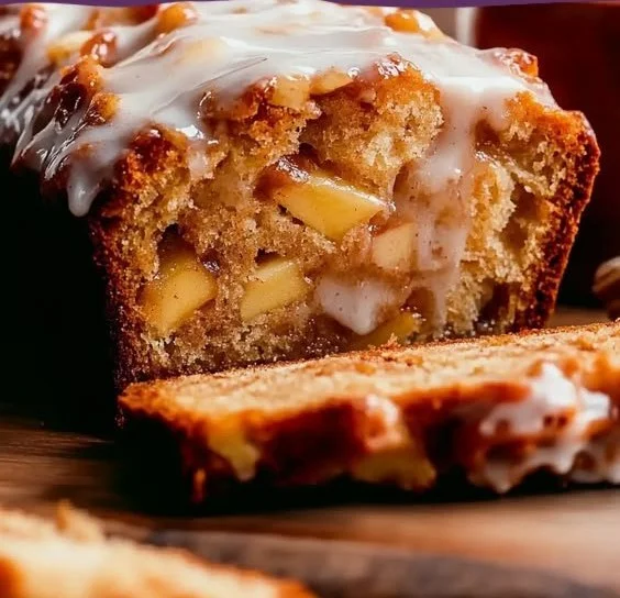 Delicious spiced apple fritter bread with chunks of apples and a glaze