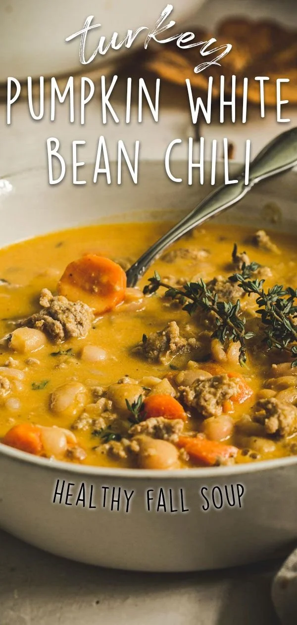Bowl of Turkey Pumpkin White Bean Chili garnished with herbs