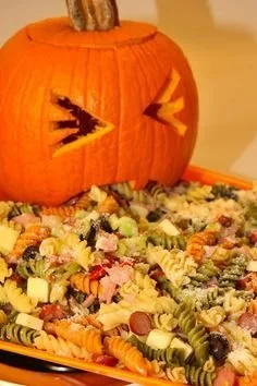 Upchuckin' Pumpkin Loaded Pasta Salad served in a bowl with fresh herbs