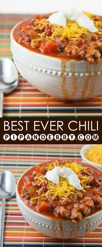 Bowl of delicious chili topped with cheese and herbs, showcasing the best chili recipe.