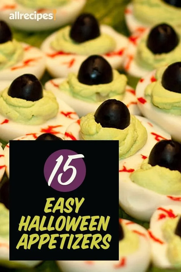 Variety of Halloween appetizers on a spooky themed table
