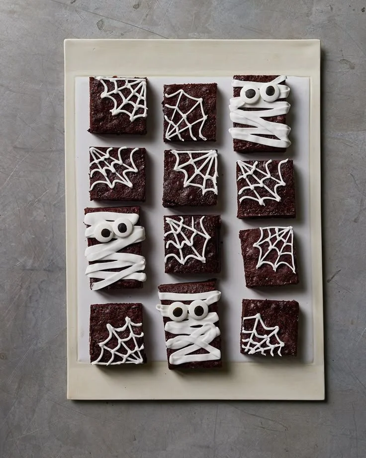 A variety of Halloween snacks displayed for a spooky party.