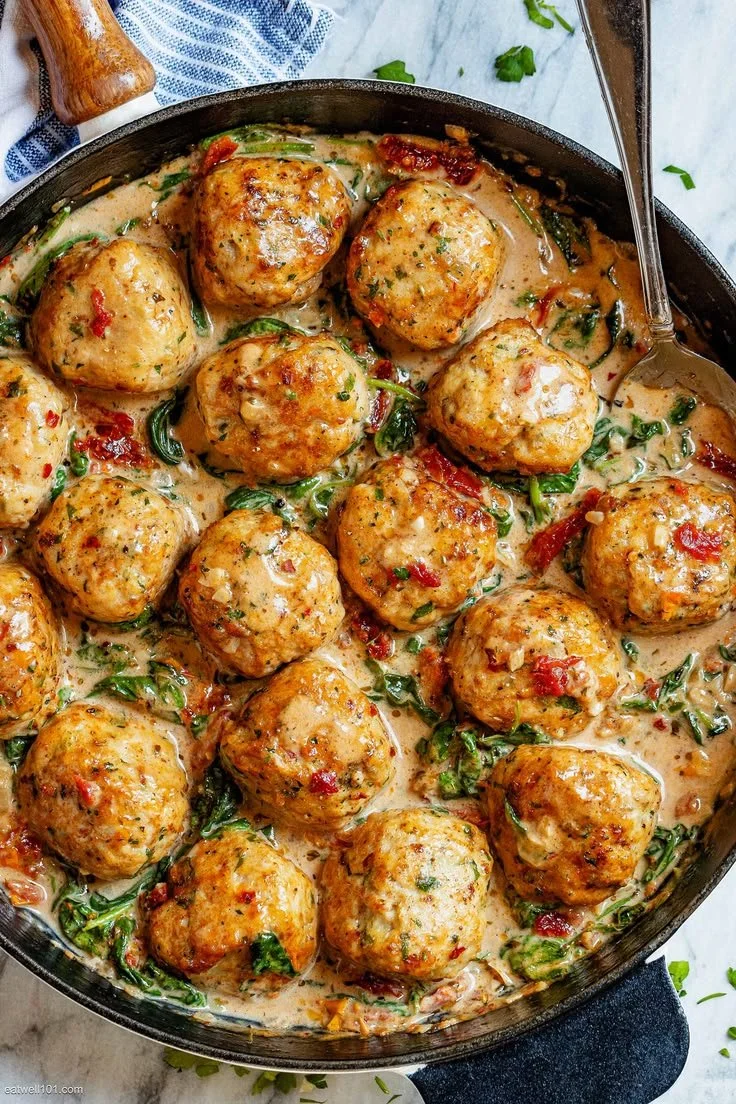 Delicious creamy spinach turkey meatballs served on a plate