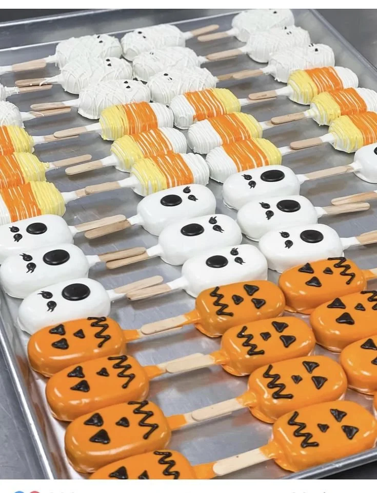Creative Halloween treats including cakesickles and cake pops for festive celebrations.
