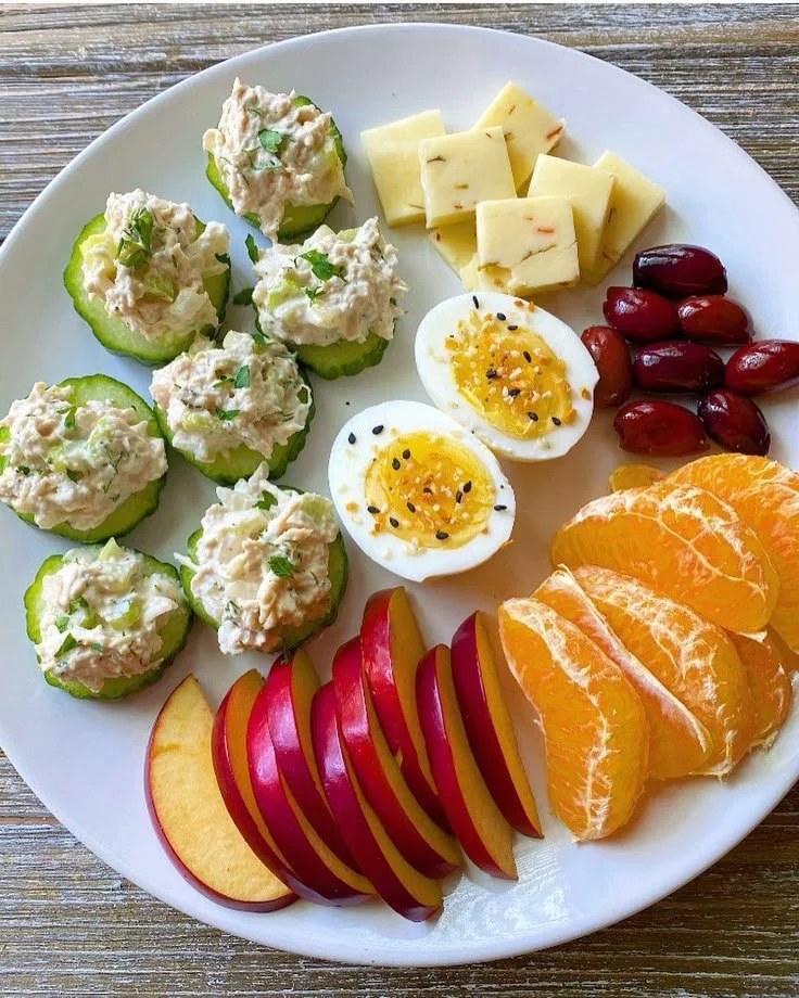 Assorted healthy breakfast options including fruits, oatmeal, and smoothies.