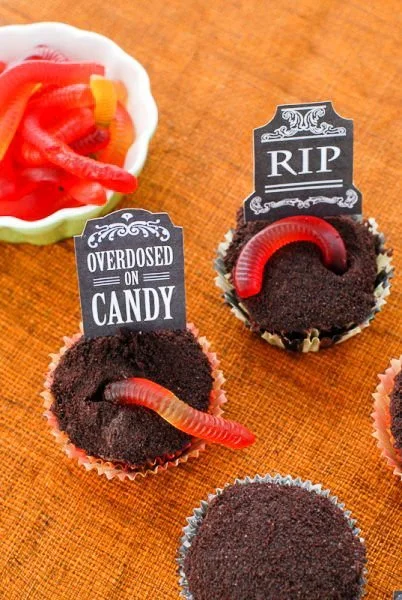 Decorated graveyard Halloween cupcakes with spooky designs