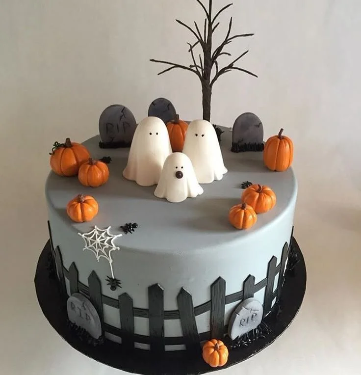 Halloween cake decorated with ghosts and pumpkins for a festive celebration