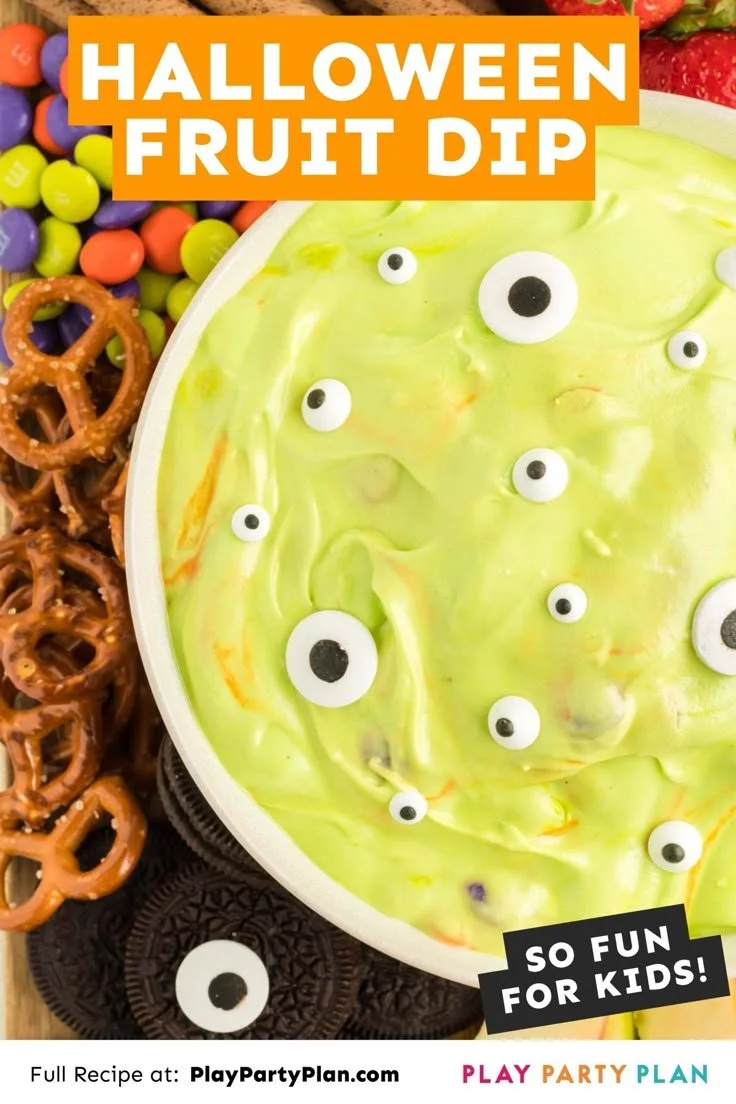 Halloween Marshmallow Dip served in a festive bowl with Halloween-themed decorations.