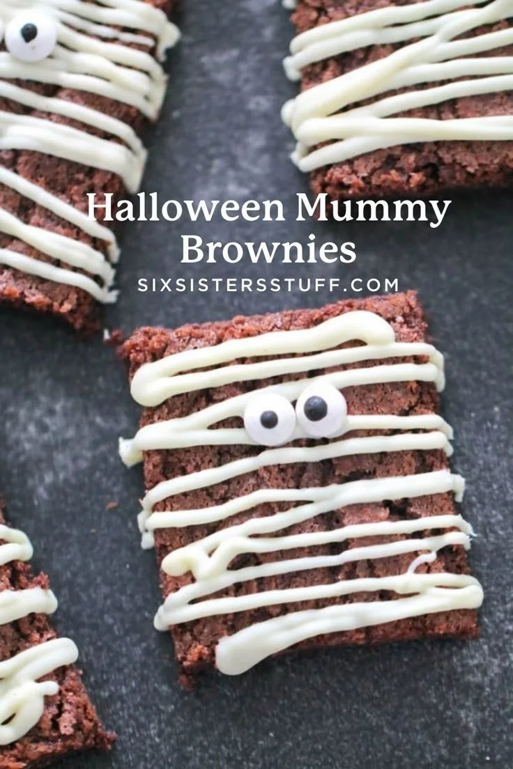 Delicious Halloween mummy brownies decorated with white icing and candy eyes