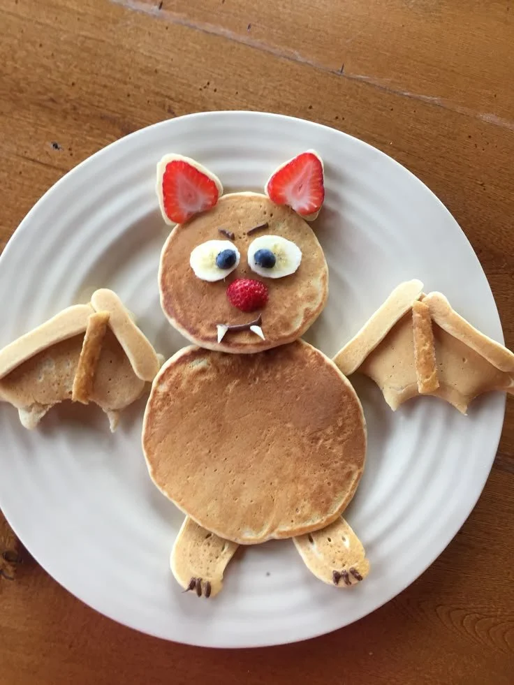 Halloween pancake decorated with spooky toppings and fun shapes for kids
