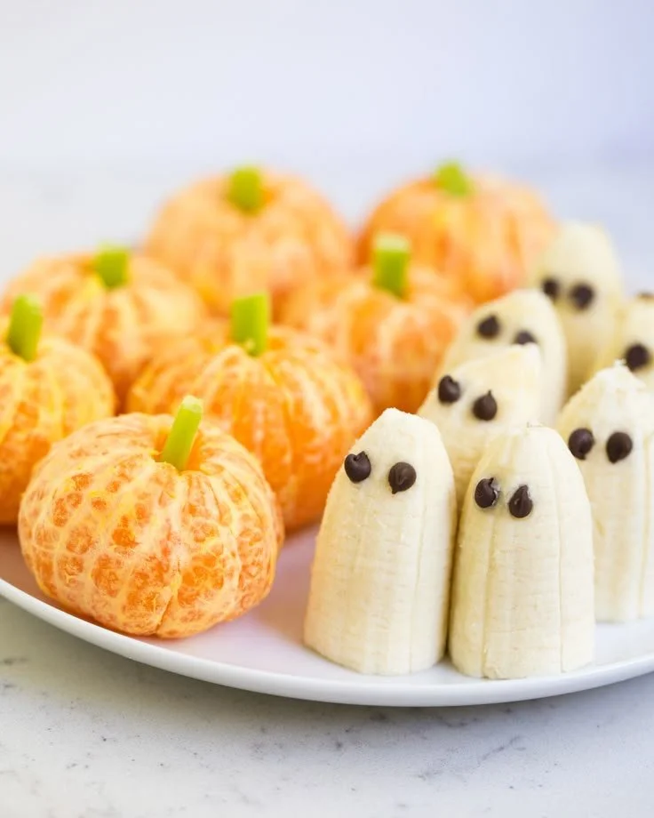 Healthy Halloween snacks ideas displayed on a festive table.