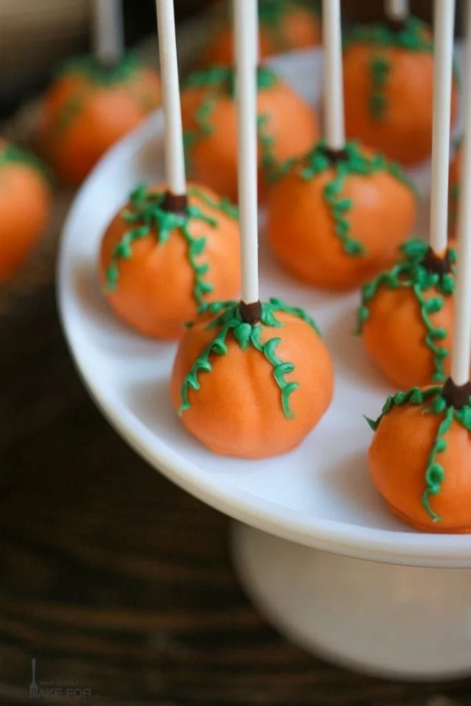 Delicious pumpkin cake pops decorated for fall festivities.
