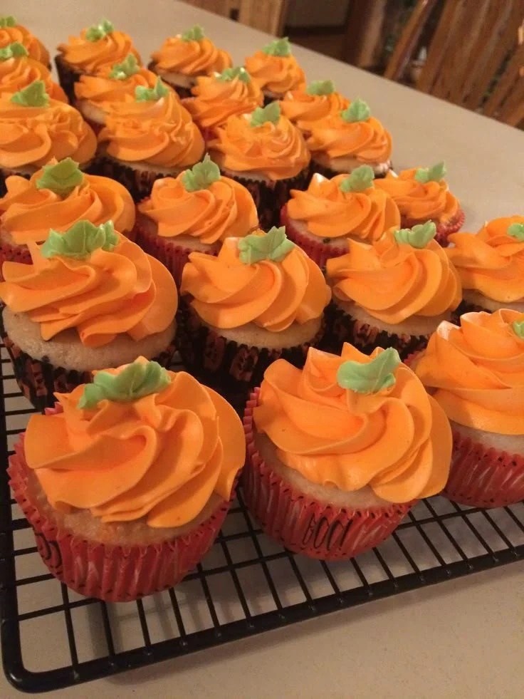 Mouthwatering pumpkin cupcakes topped with cream cheese frosting.