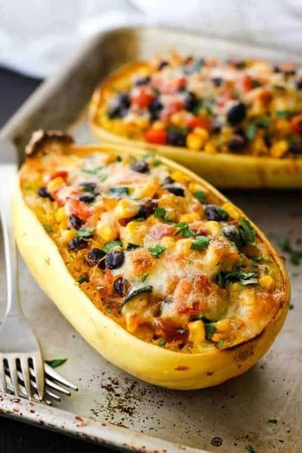 Spaghetti Squash Burrito Bowls garnished with fresh toppings.