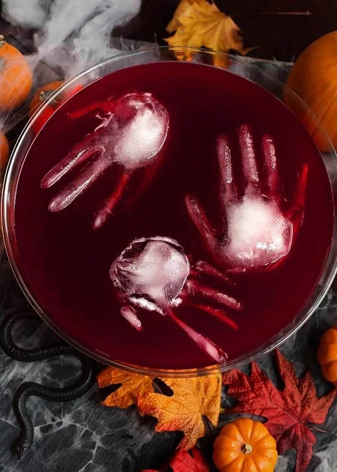 Spooky Halloween party punch served in a decorated bowl with ghostly garnishes