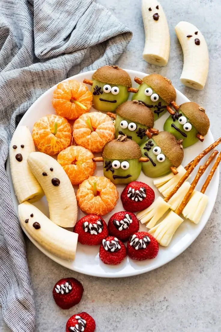 Spooky Halloween party snacks displayed on a festive table