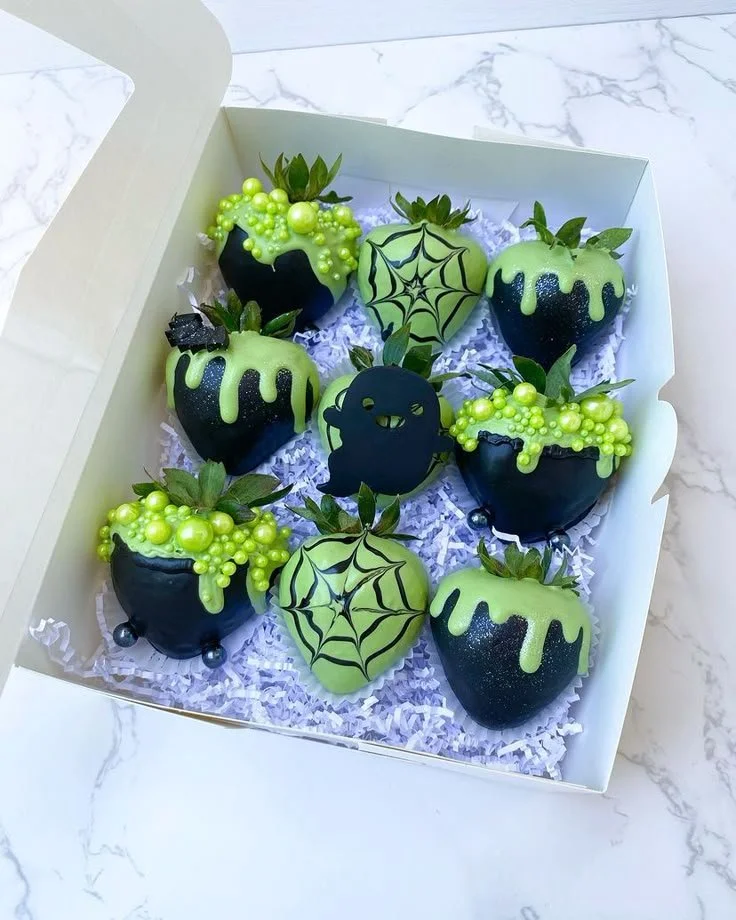 Green and black decorated strawberries for Halloween treats