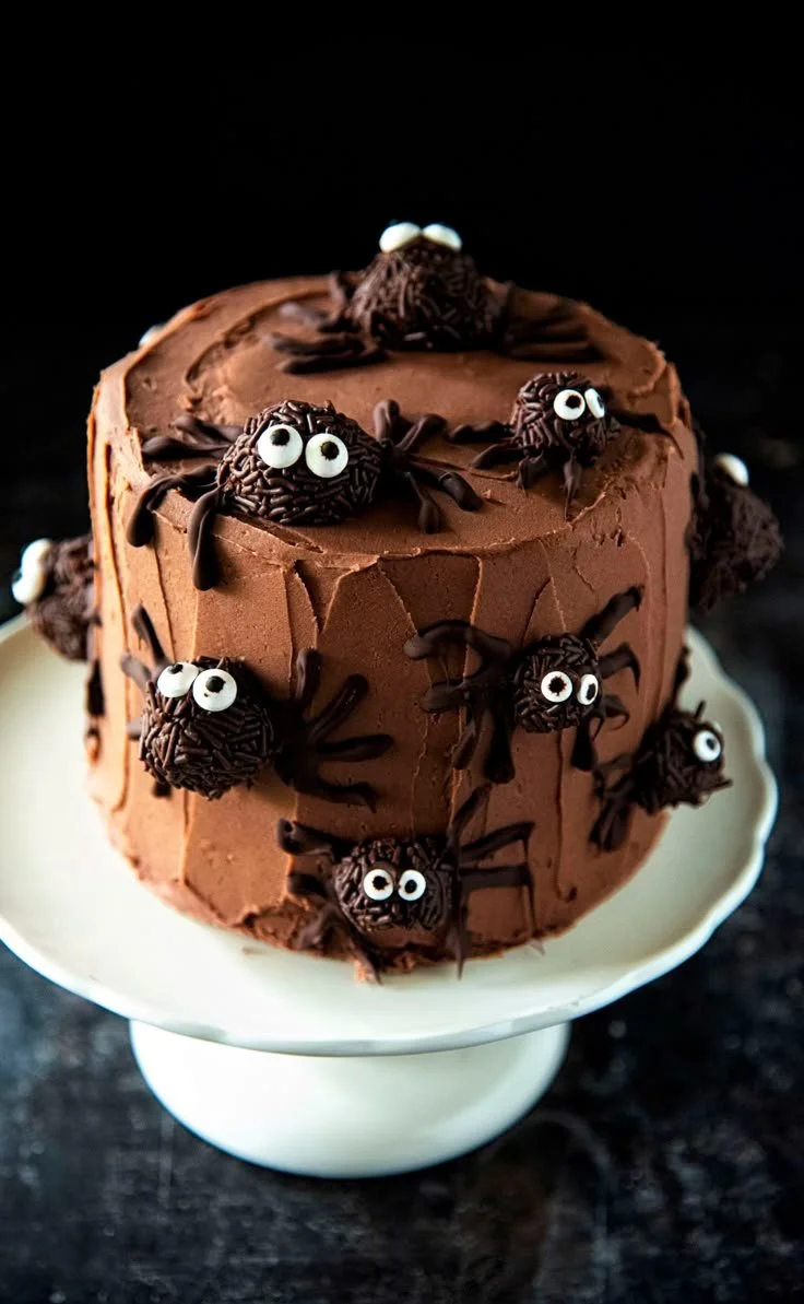 Spooky Spider Cake for Halloween with chocolate frosting and edible spider decorations