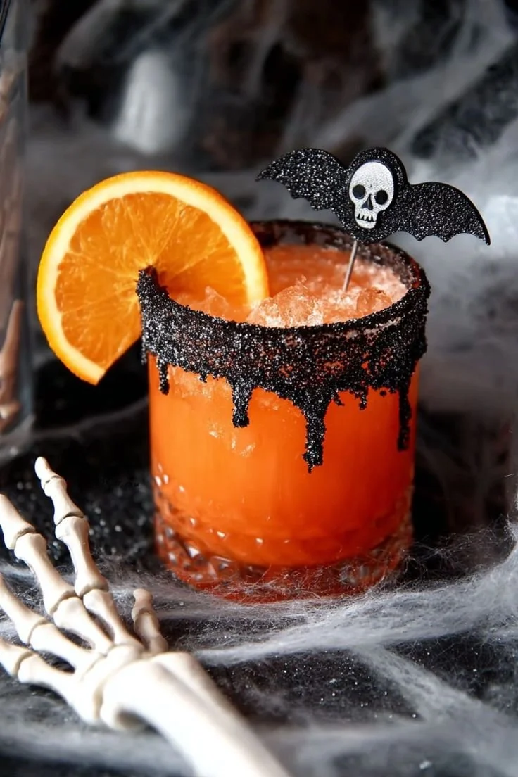 Tangy Skull Tequila Sparkler cocktail in a decorative glass with garnish.